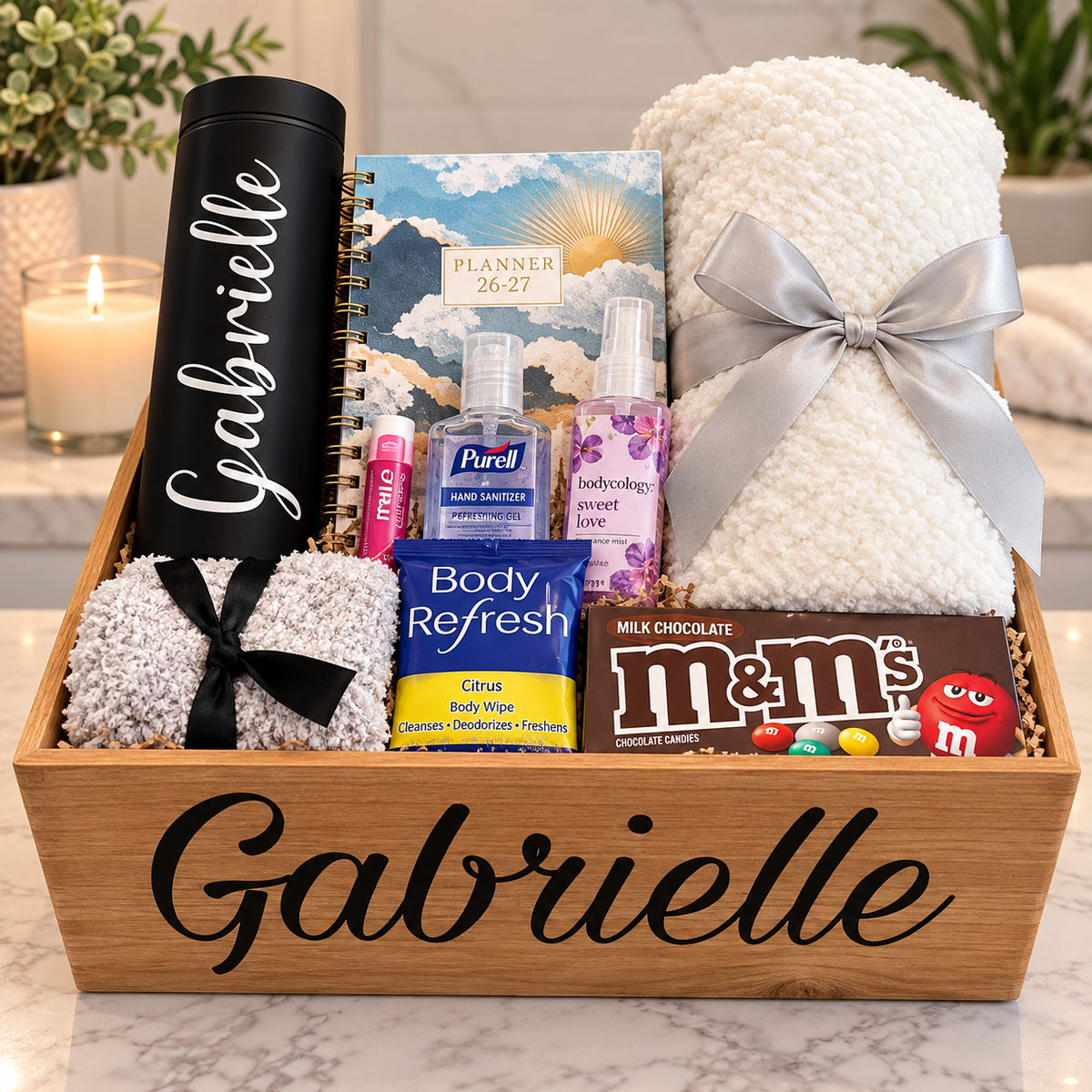 Personalized Gabrielle gift box with black tumbler, planner, fuzzy socks, white towel, body mist and chocolate
